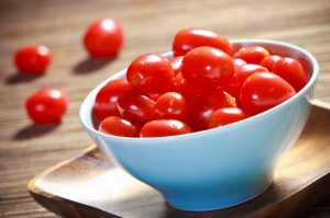Cherry tomatoes in a blue bowl
