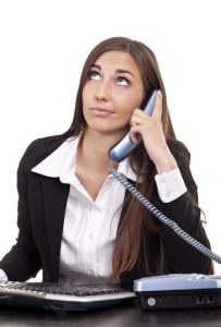 businesswoman having  boring call in office